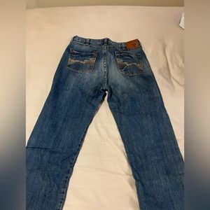 Men’s wrangler 20x blue jeans.